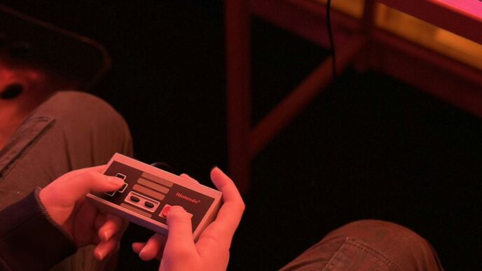 a person sitting on the floor playing a video game