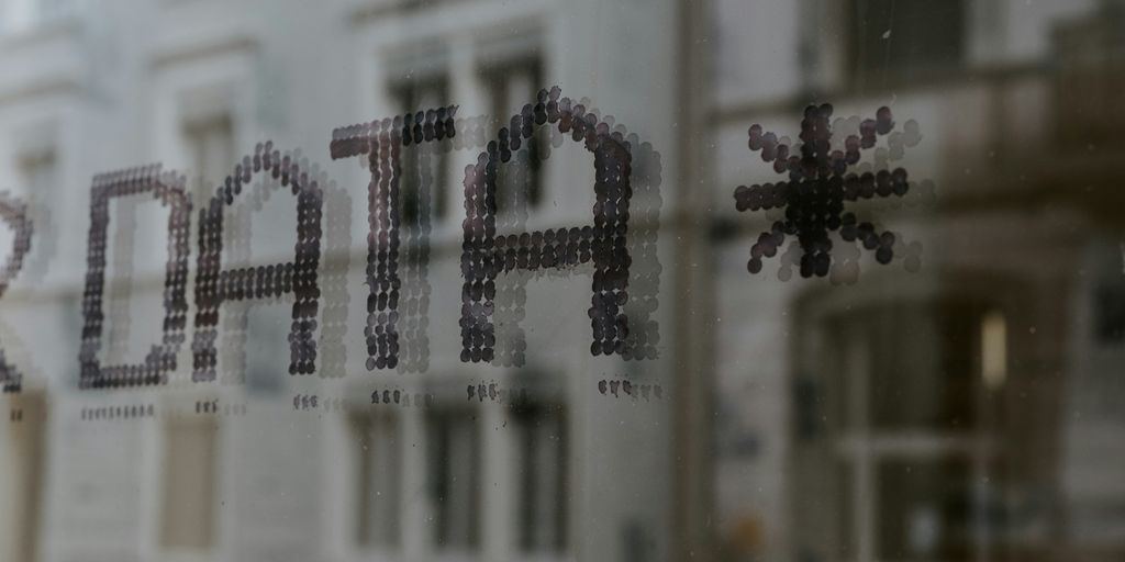 a close up of a window with a building in the background