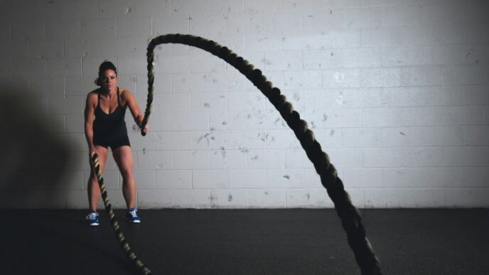 woman holding brown ropes
