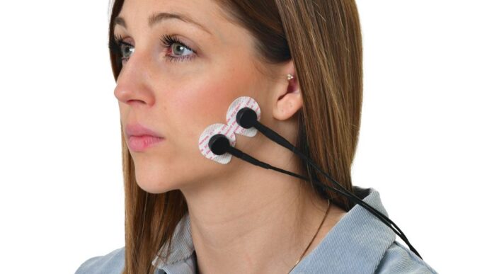 a woman wearing a pair of ear buds