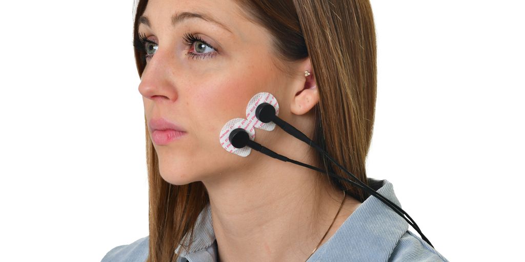 a woman wearing a pair of ear buds