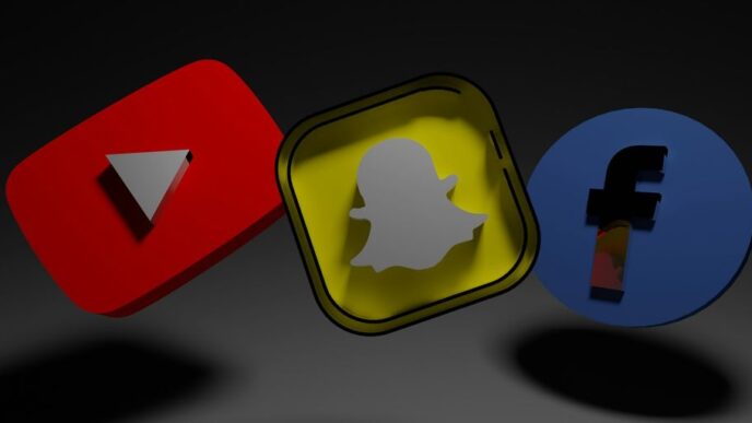 a group of three different colored objects on a black background