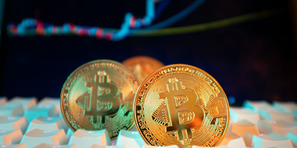 Bitcoin coins are displayed with a stock chart.