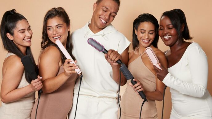 a group of women standing next to each other holding hairdryers