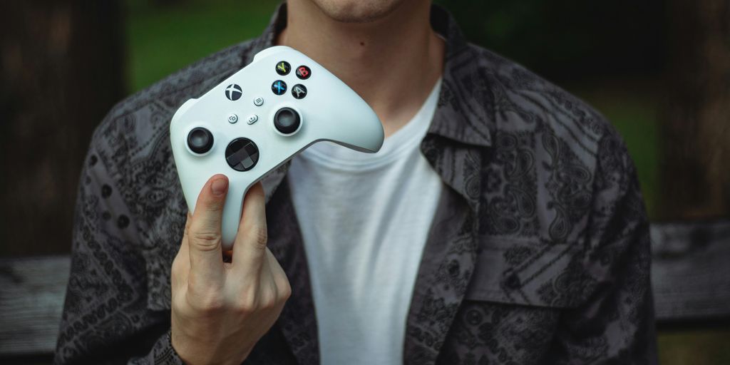 a person holding a video game controller