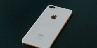 gold iPhone 7 Plus on black surface