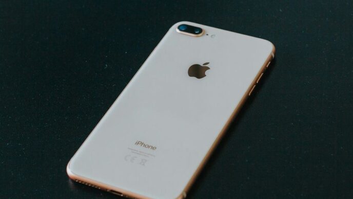 gold iPhone 7 Plus on black surface
