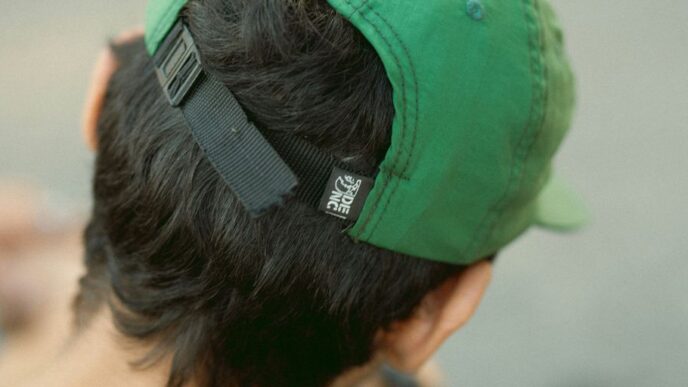 a man with a green hat on top of his head