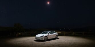 a car parked in a dirt lot