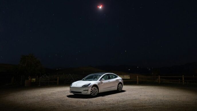 a car parked in a dirt lot