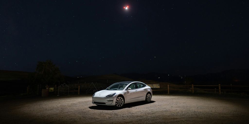 a car parked in a dirt lot