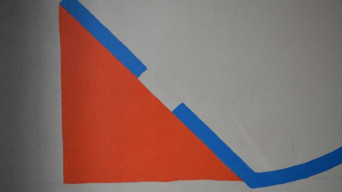 a drawing of a triangle on a white wall