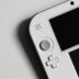 white nintendo game boy on white table