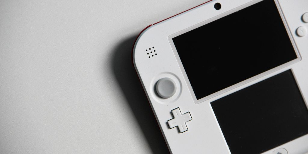 white nintendo game boy on white table