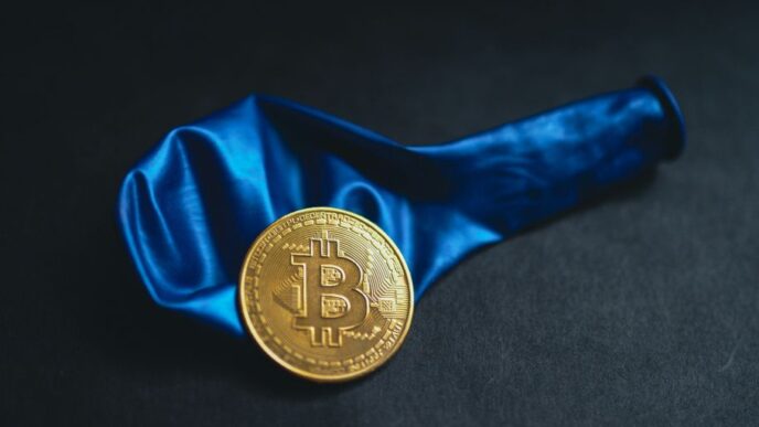 a bitcoin is sitting on a blue cloth