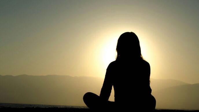 woman sitting on sand