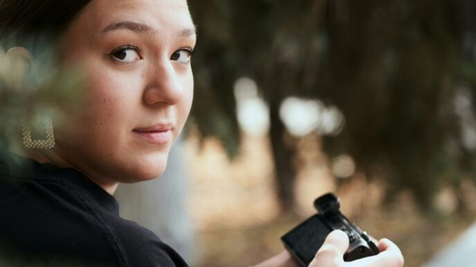 a woman holding a camera in her hands