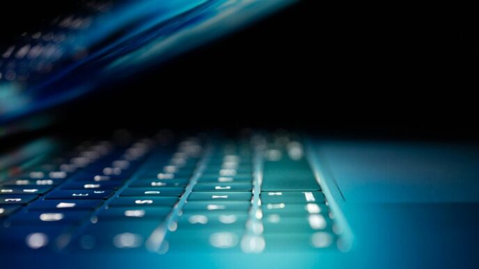 closeup photo of turned-on blue and white laptop computer