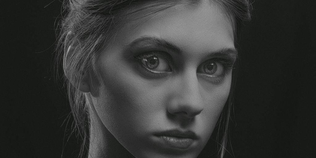 a black and white photo of a woman's face