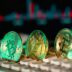 Cryptocurrency coins sit on a keyboard.