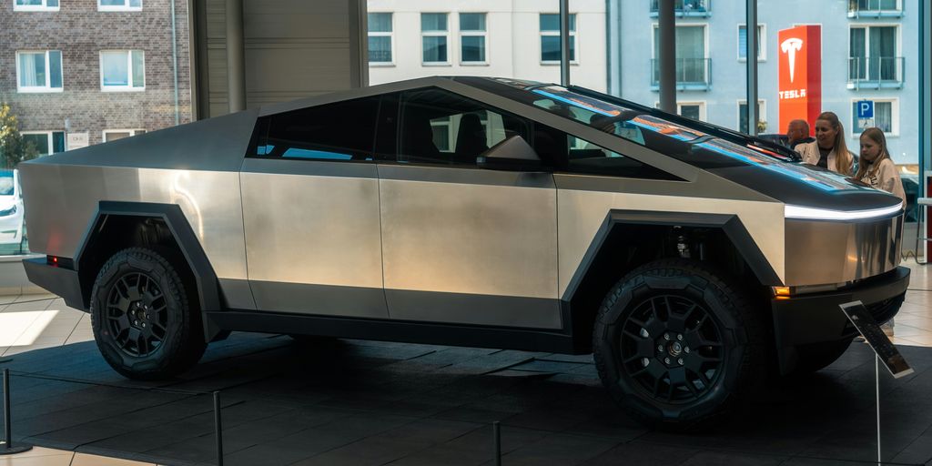A futuristic car is on display in a building