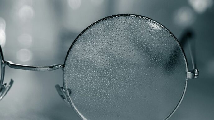 a pair of glasses sitting on top of a table