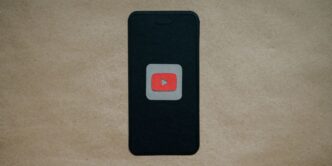 a black cell phone with a red youtube logo on it