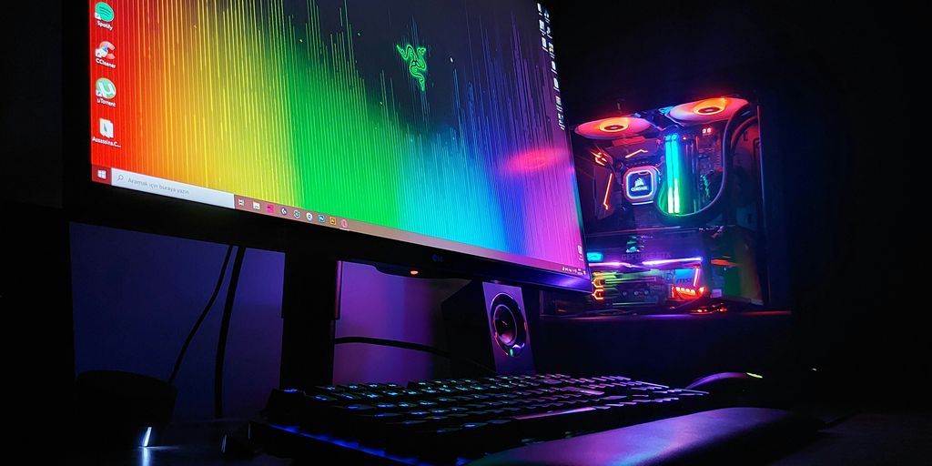 black flat screen computer monitor turned on beside black computer keyboard
