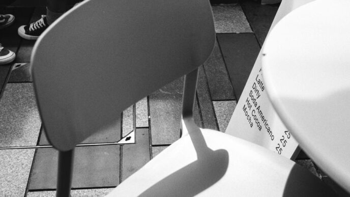 a white chair sitting on top of a tiled floor