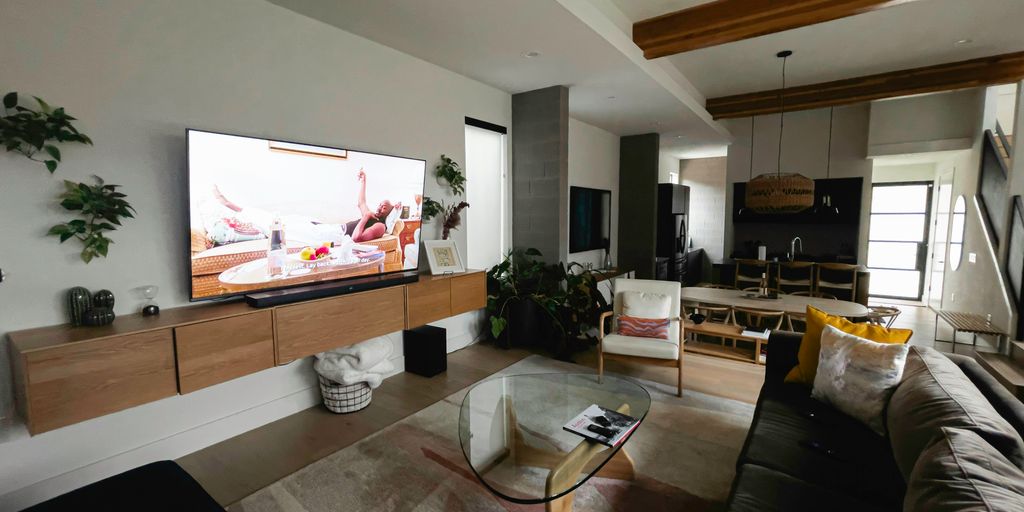 A living room filled with furniture and a flat screen TV