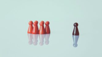 brown game pieces on white surface
