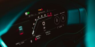 a close up of a car dashboard with a speedometer