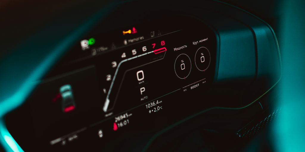a close up of a car dashboard with a speedometer