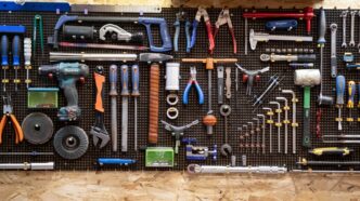 A bunch of tools hanging up on a wall