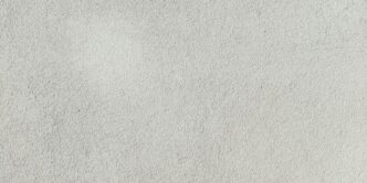 a close up of a white stucco wall