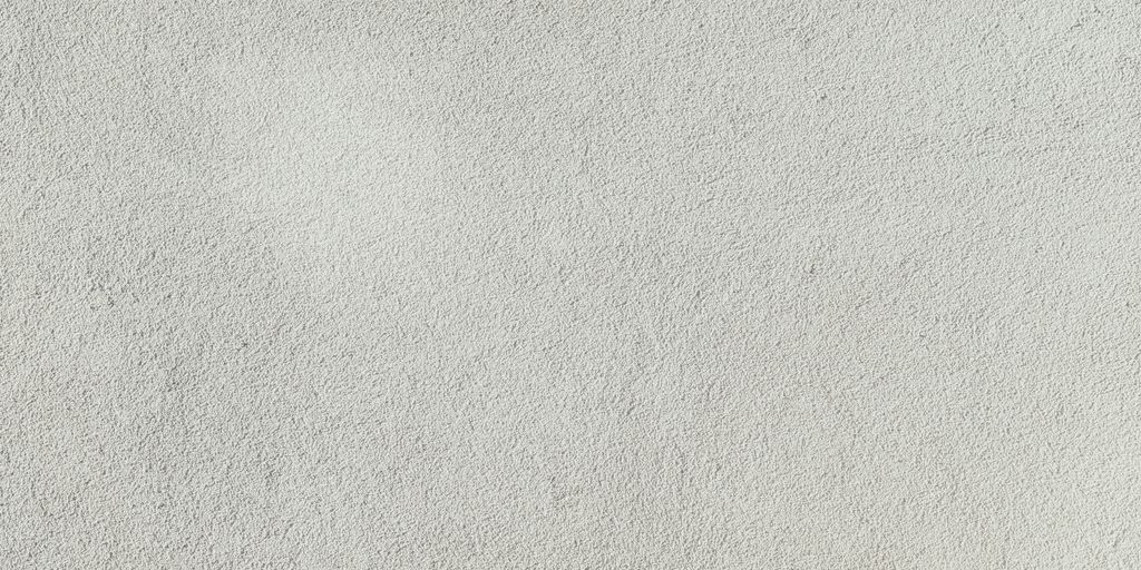 a close up of a white stucco wall