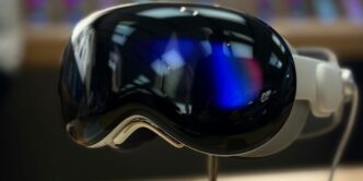 A pair of ski goggles sitting on top of a wooden table