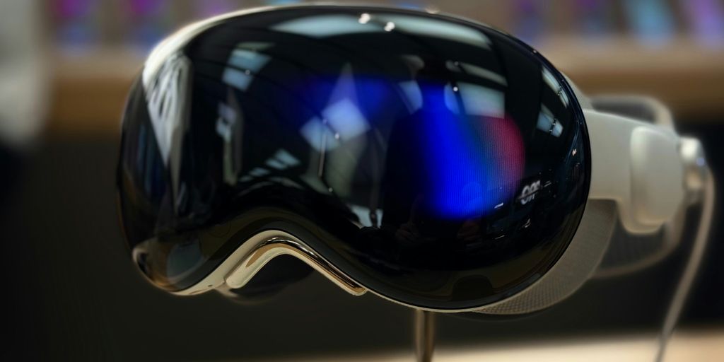 A pair of ski goggles sitting on top of a wooden table