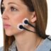 a woman wearing a pair of ear buds