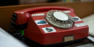 red and silver rotary phone