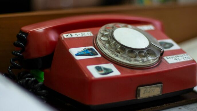 red and silver rotary phone