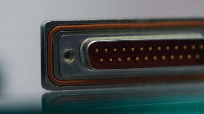 a close up of a metal object with a reflection on the surface