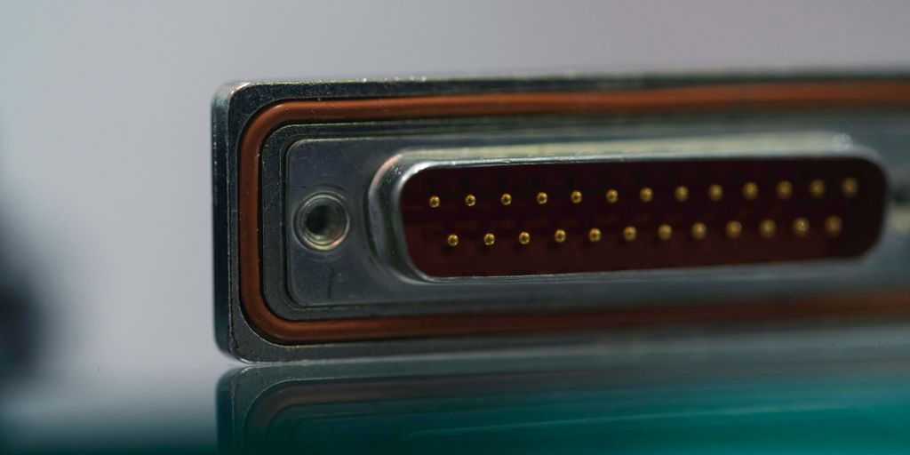 a close up of a metal object with a reflection on the surface