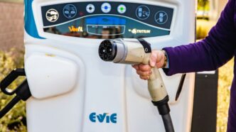 a person using a gas pump