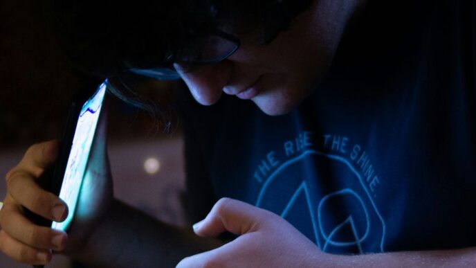 man using smartphone looking at his hands