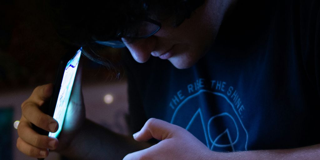 man using smartphone looking at his hands