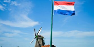white and blue flag on pole during daytime