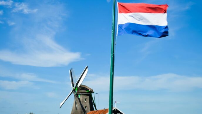 white and blue flag on pole during daytime