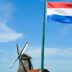 white and blue flag on pole during daytime
