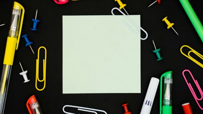 yellow and pink pen on gray paper